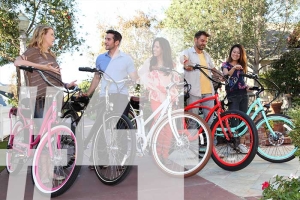 group of people with their pedego electric bikes