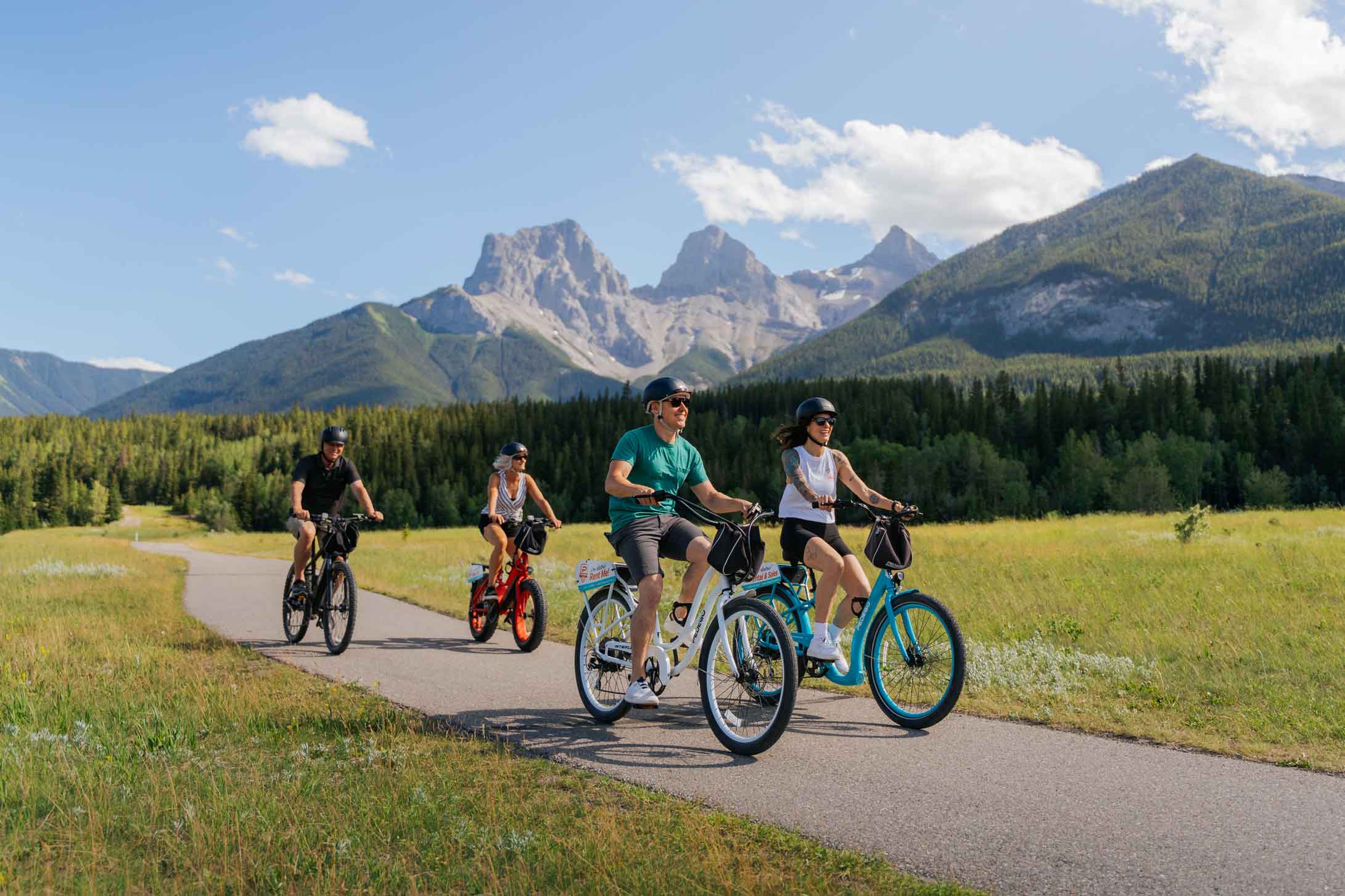 Happy Canadians Riding Pedego Electric Bikes in Canmore Alberta