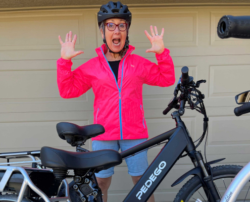 Pedego Oyama owner in pink jacket by ebike