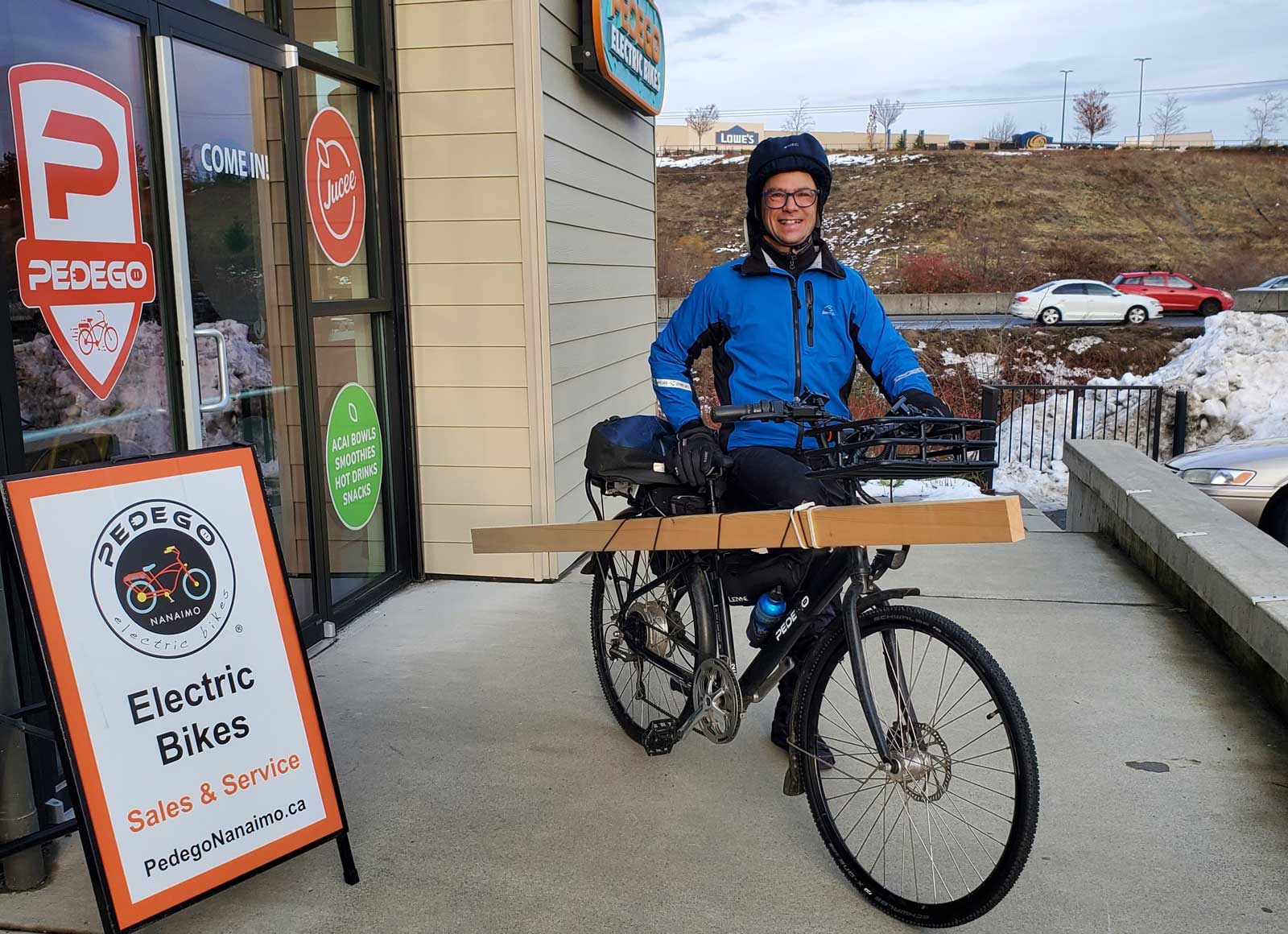 Dustin Anderson commutes to and from work on a Pedego City Commuter carrying cargo.