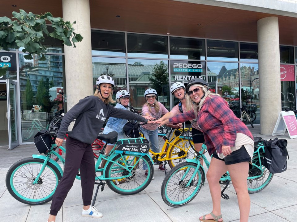 A group of women who are renting Pedego ebikes from Pedego Electric bikes Victoria